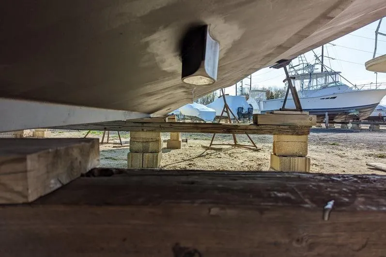Slide: The Image of 2005 Egg Harbor 43 SportYacht on blocks, underbody view in a boatyard. - 14