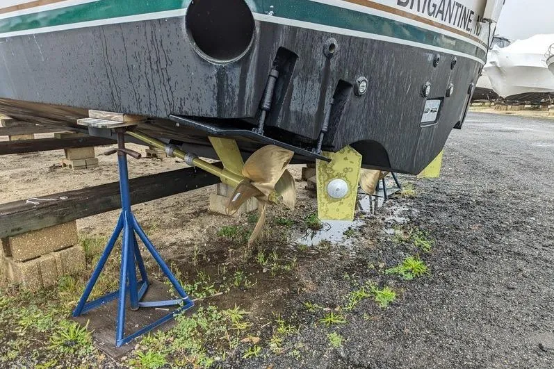 Slide: The Image of Egg Harbor 43 SportYacht 2005 on stands, showing propeller and rudder in a boatyard. - 15