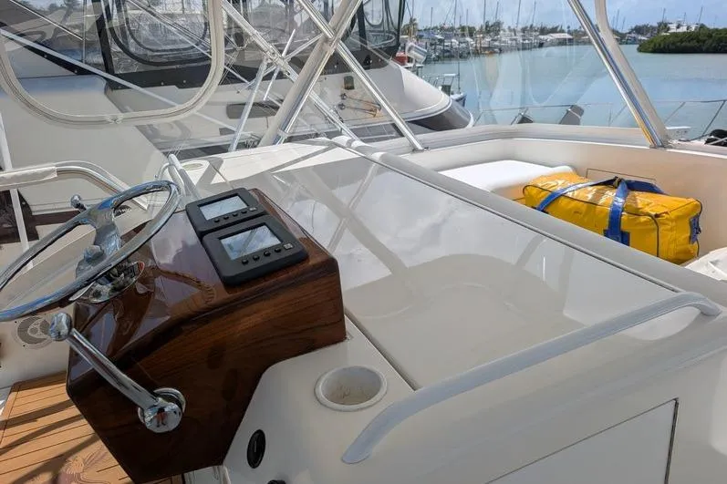 Slide: The Image of Helm of 2005 Egg Harbor 43 SportYacht with steering wheel and navigation instruments. - 17