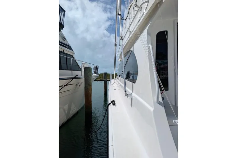 Slide: The Image of Side view of a 2005 Egg Harbor 43 SportYacht docked at a marina. - 22
