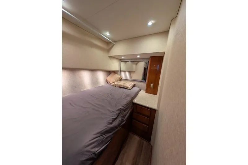 Slide: The Image of Interior cabin of 2005 Egg Harbor 43 SportYacht with bed and storage drawers. - 27
