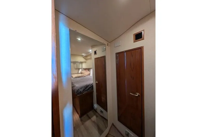 Slide: The Image of Interior of 2005 Egg Harbor 43 SportYacht with cozy bedroom and wooden cabinetry. - 30
