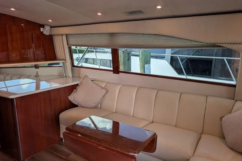 Slide: The Image of Luxurious interior of 2005 Egg Harbor 43 SportYacht with plush seating and elegant wood finishes. - 35