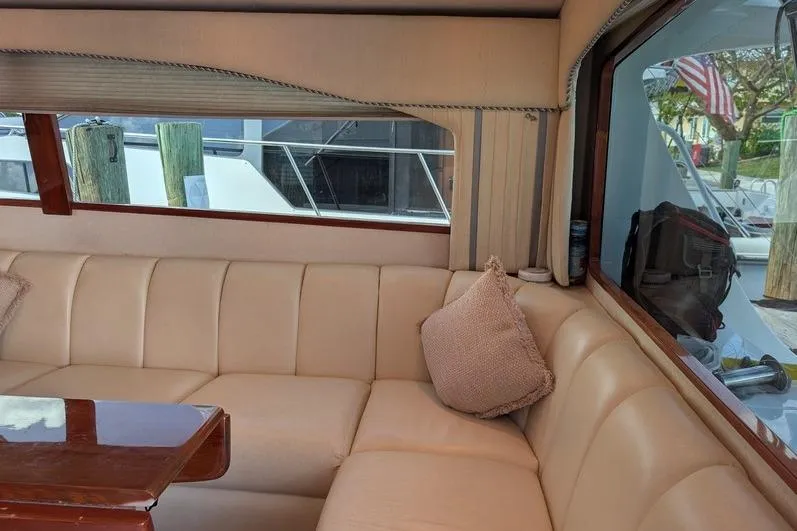 Slide: The Image of Luxurious interior of 2005 Egg Harbor 43 SportYacht with beige leather seating. - 36