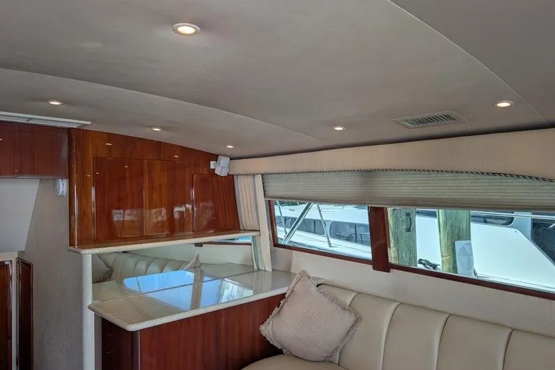 Slide: The Image of Luxurious interior of 2005 Egg Harbor 43 SportYacht with plush seating and elegant wood finishes. - 38