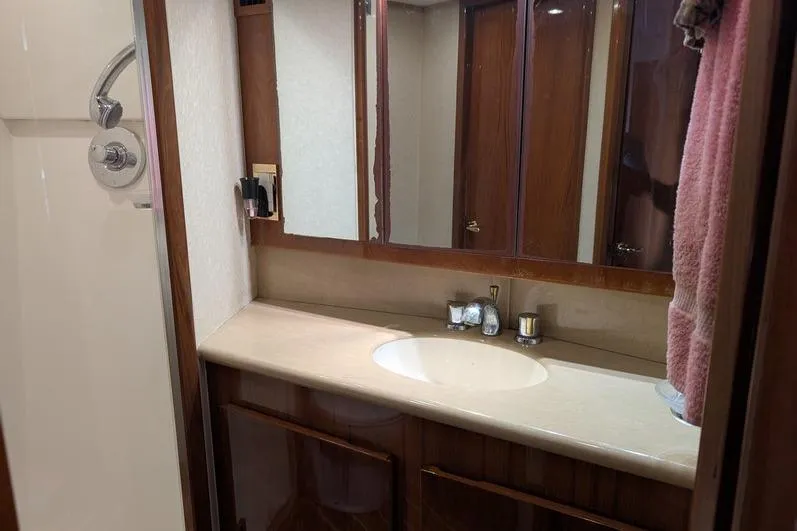 Slide: The Image of Luxurious bathroom interior of 2005 Egg Harbor 43 SportYacht with elegant wood finishes. - 45