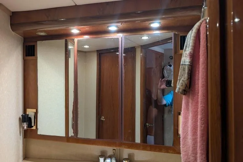Slide: The Image of Bathroom vanity with mirrors and lights in 2005 Egg Harbor 43 SportYacht. - 46