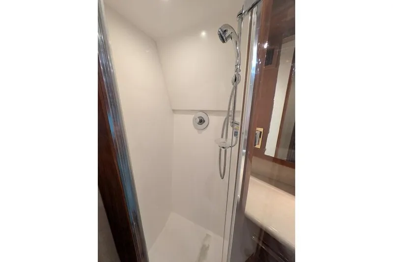 Slide: The Image of Shower area in 2005 Egg Harbor 43 SportYacht, featuring sleek design and modern fixtures. - 47