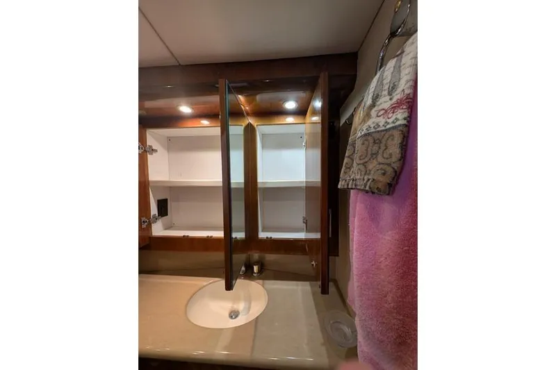 Slide: The Image of Bathroom vanity with open cabinet in 2005 Egg Harbor 43 SportYacht. - 50