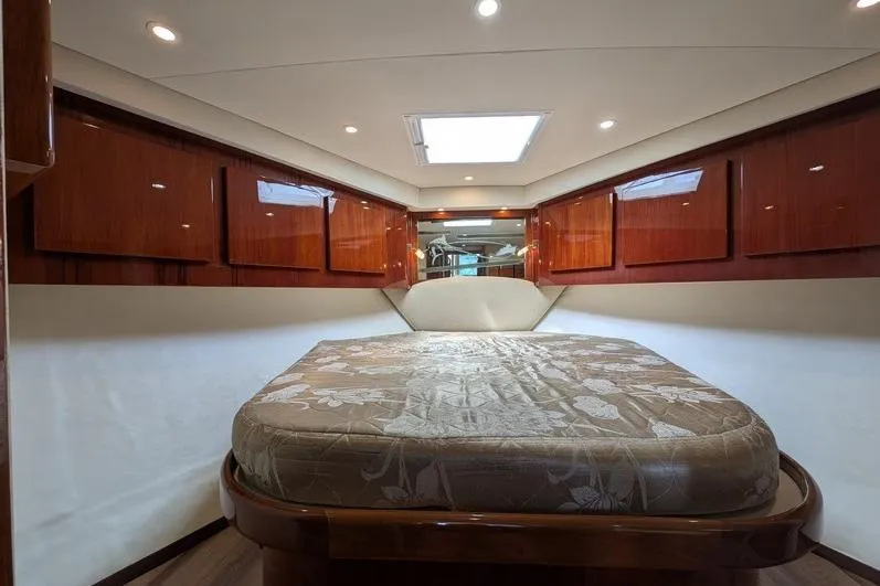 Slide: The Image of Luxurious cabin interior of 2005 Egg Harbor 43 SportYacht with elegant wood finishes. - 56