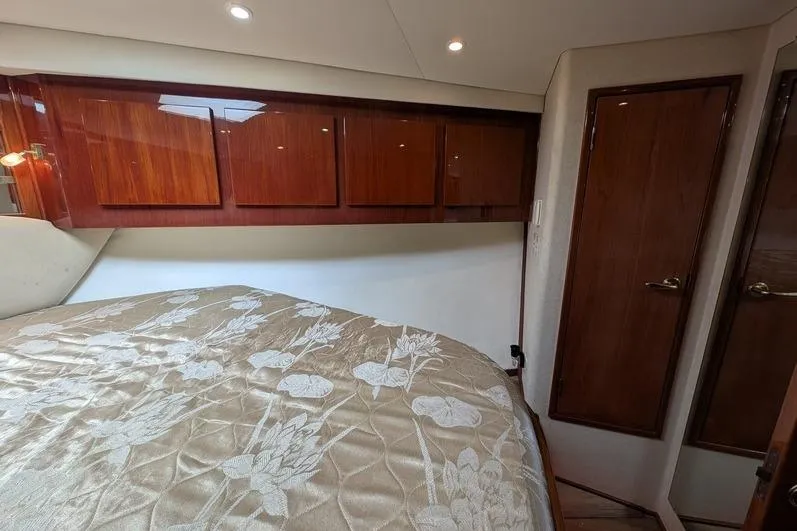 Slide: The Image of Luxurious cabin interior of 2005 Egg Harbor 43 SportYacht with elegant wood finishes. - 58