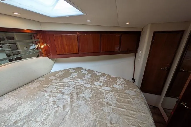 Slide: The Image of Luxurious cabin interior of 2005 Egg Harbor 43 SportYacht with elegant bedding and wood cabinetry. - 61