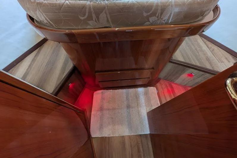 Slide: The Image of Interior of 2005 Egg Harbor 43 SportYacht with wood finish and red accent lighting. - 63