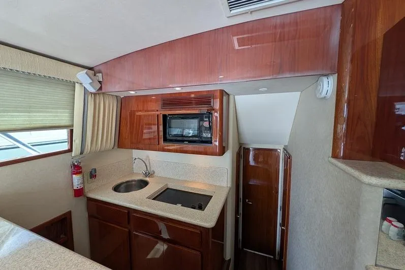 Slide: The Image of Interior of 2005 Egg Harbor 43 SportYacht kitchen with microwave and sink. - 68