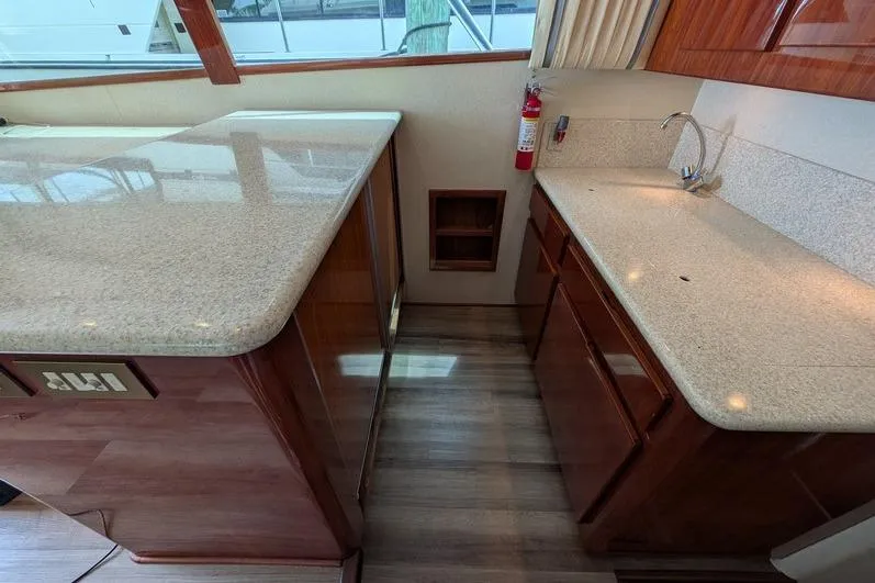 Slide: The Image of Luxurious kitchen area in a 2005 Egg Harbor 43 SportYacht with sleek countertops. - 69