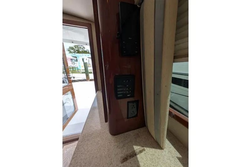 Slide: The Image of Interior view of 2005 Egg Harbor 43 SportYacht showing control panel and electrical outlet. - 73