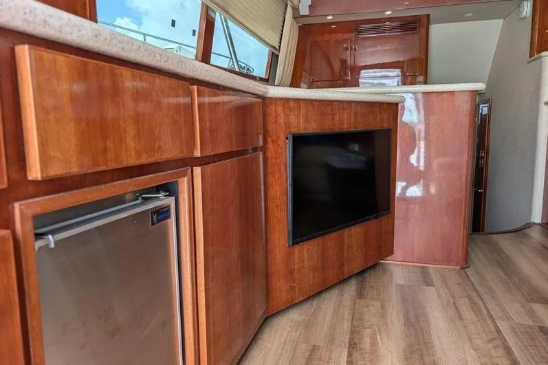Slide: The Image of Interior of 2005 Egg Harbor 43 SportYacht with wood cabinetry and built-in TV. - 77