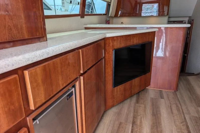 Slide: The Image of Interior of 2005 Egg Harbor 43 SportYacht with wood cabinetry and modern appliances. - 78