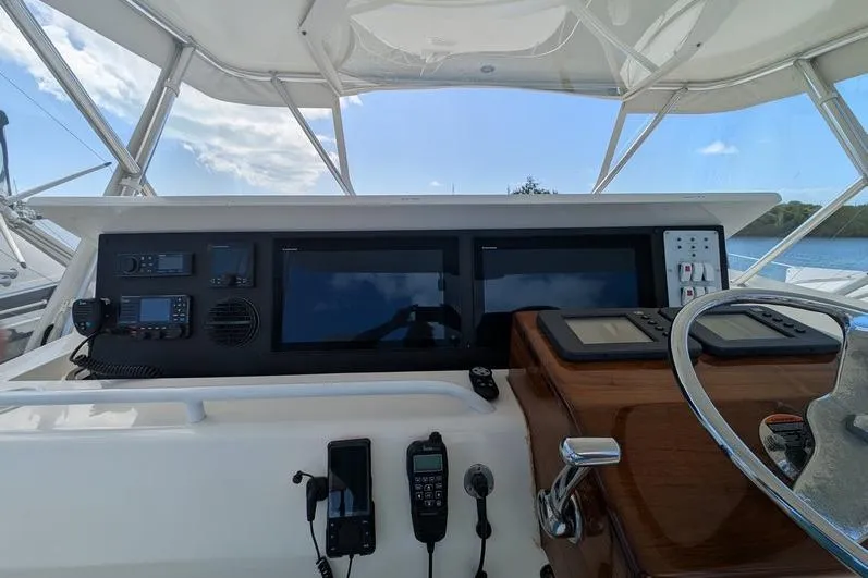Slide: The Image of Helm of 2005 Egg Harbor 43 SportYacht with navigation equipment and steering wheel. - 85