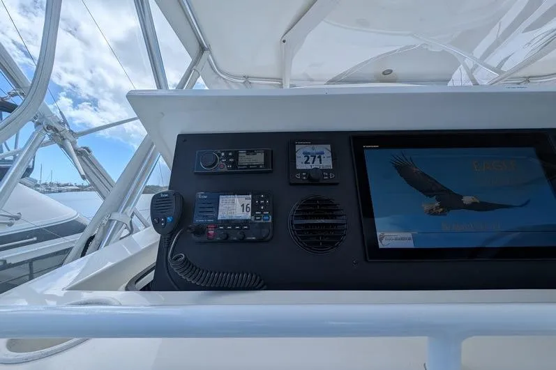 Slide: The Image of Control panel of a 2005 Egg Harbor 43 SportYacht with navigation equipment and display screen. - 87