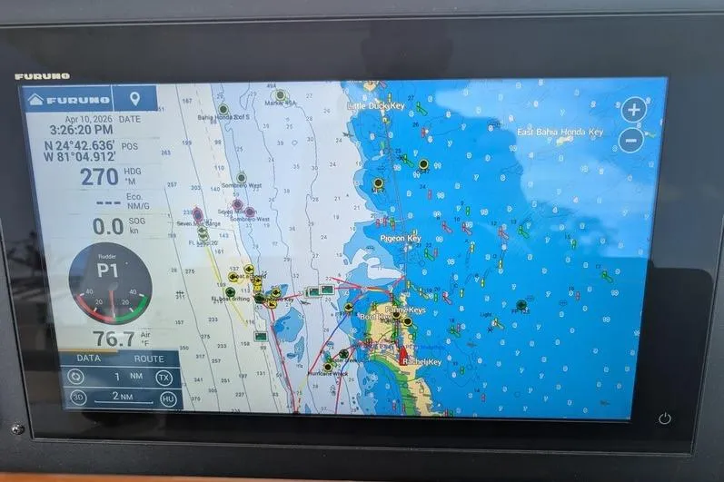 Slide: The Image of Navigation display on 2005 Egg Harbor 43 SportYacht showing marine chart and coordinates. - 92