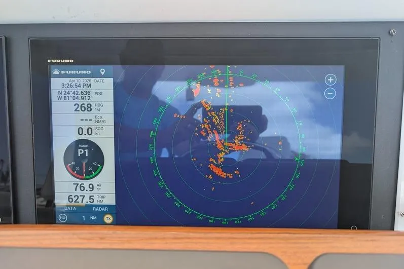 Slide: The Image of Radar display on 2005 Egg Harbor 43 SportYacht showing navigation data and coordinates. - 93