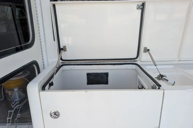 Slide: The Image of Open storage compartment on 2005 Egg Harbor 43 SportYacht, showcasing interior space. - 98