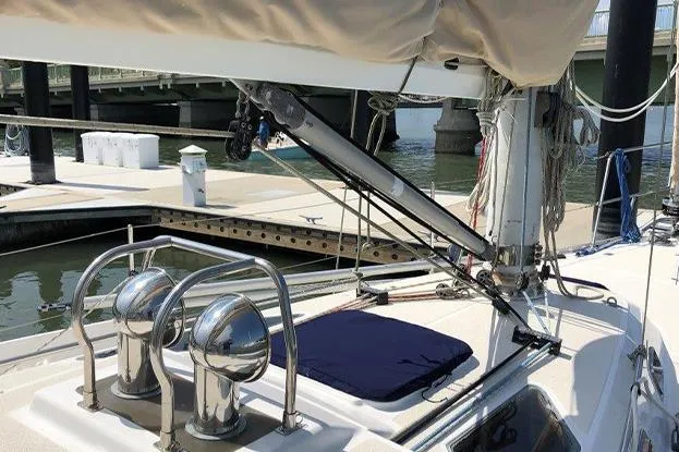 Slide: The Image of Sailboat deck view of a 1995 Freedom 35 at a marina dock. - 2
