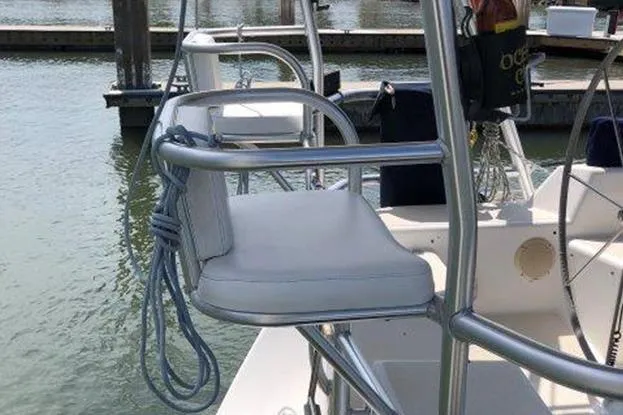 Slide: The Image of Sailboat cockpit with cushioned seat, Freedom 35 model, docked at marina, 1995. - 4