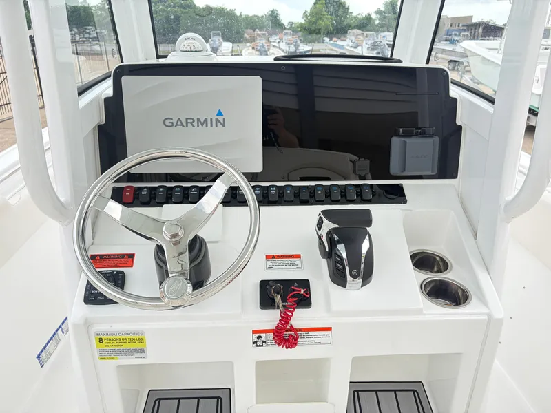 Slide: The Image of 2021 Sea Hunt Ultra 239 SE helm with Garmin navigation system. - 11