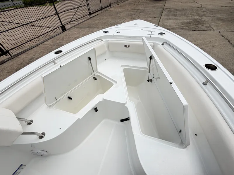 Slide: The Image of Open storage compartments on a 2021 Sea Hunt Ultra 239 SE boat. - 15