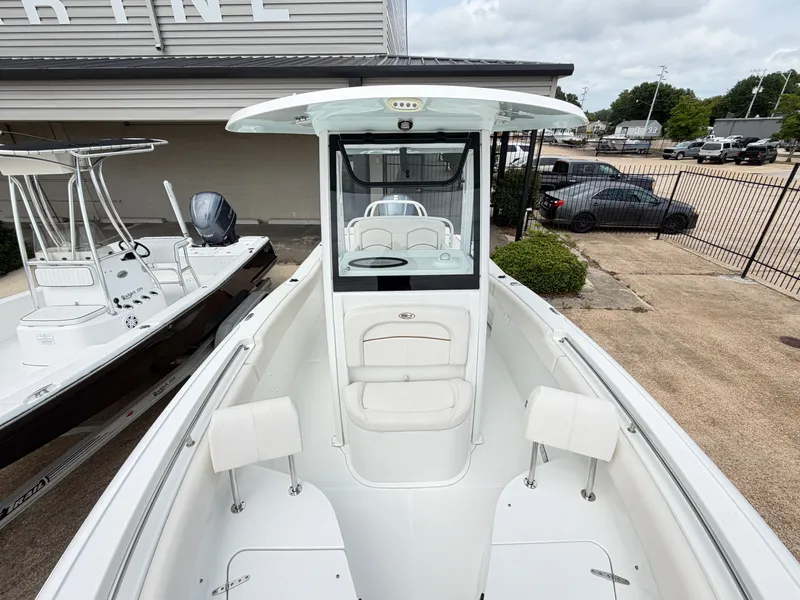Slide: The Image of 2021 Sea Hunt Ultra 239 SE boat parked at marina. - 16