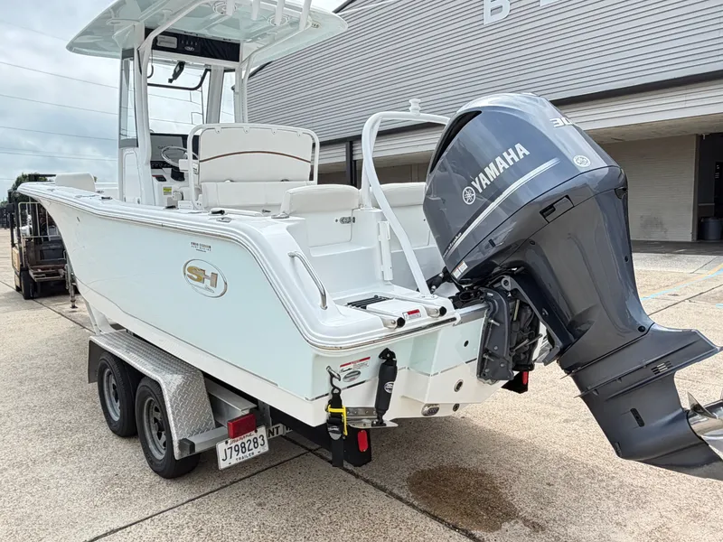 Slide: The Image of 2021 Sea Hunt Ultra 239 SE boat with Yamaha outboard motor. - 6