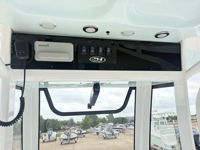 Slide: The Image of 2021 Sea Hunt Ultra 239 SE boat console with Garmin device. - 9