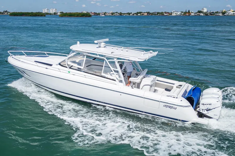 Slide: The Image of 2014 Intrepid 400 Cuddy cruising on blue ocean waters. - 2