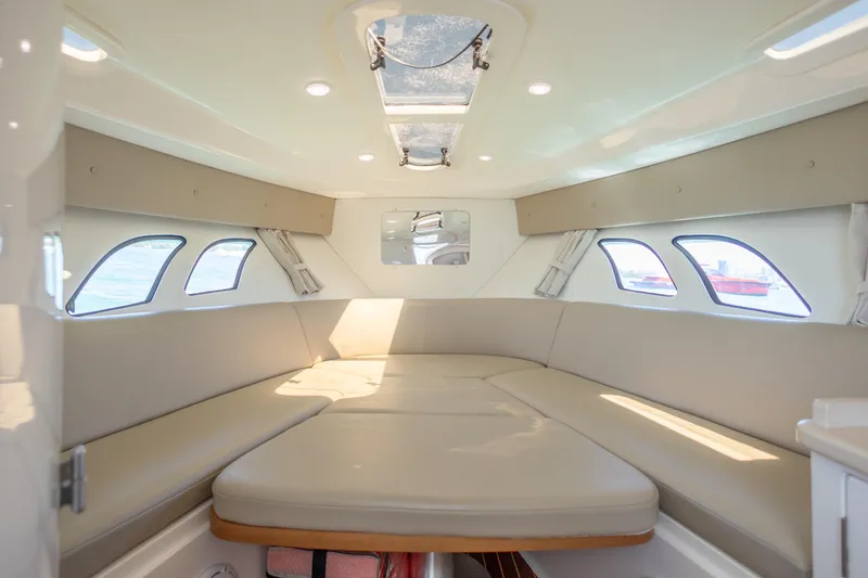 Slide: The Image of Interior of 2014 Intrepid 400 Cuddy boat with spacious seating and windows. - 31