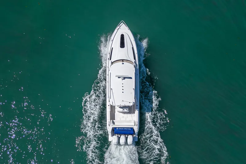 Slide: The Image of Aerial view of 2014 Intrepid 400 Cuddy boat cruising on turquoise water. - 6