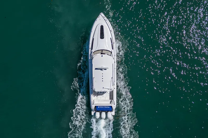 Slide: The Image of Overhead view of 2014 Intrepid 400 Cuddy cruising on clear blue water. - 8
