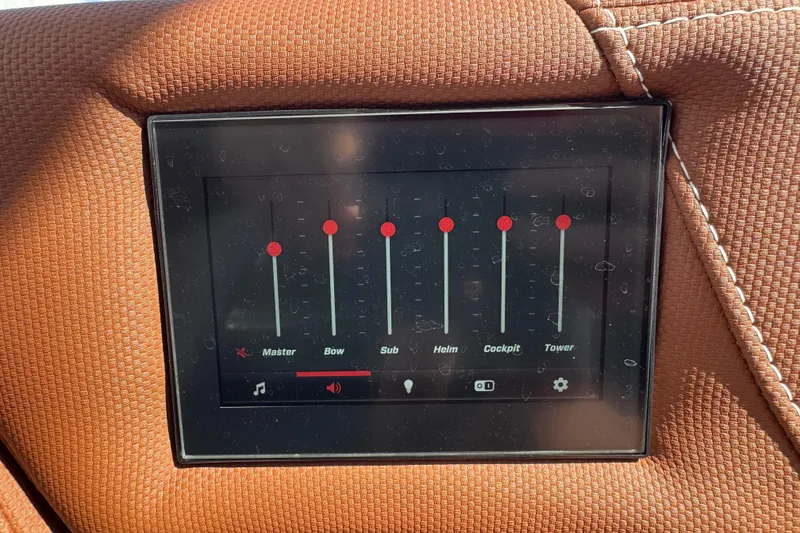 Slide: The Image of Touchscreen audio control panel on 2021 MasterCraft X24 boat dashboard. - 17