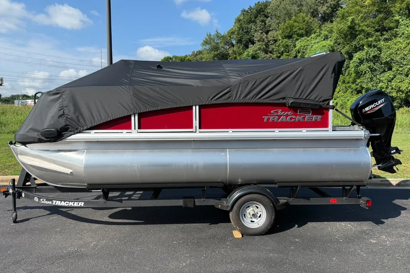 Slide: The Image of 2026 Sun Tracker Bass Buggy 16 XL Select pontoon boat with cover on trailer. - 7