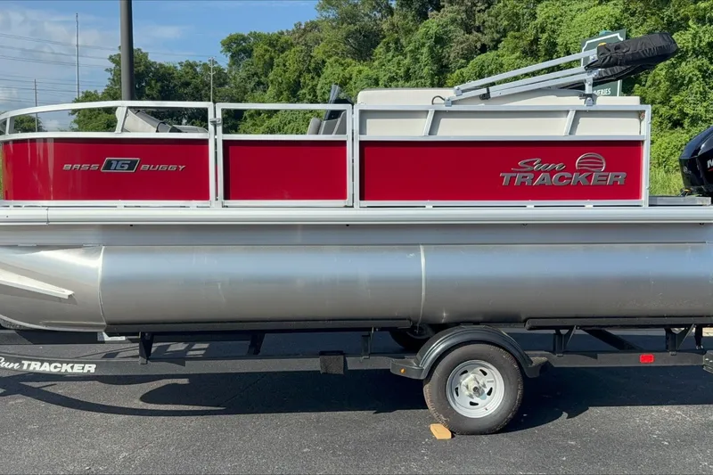 Slide: The Image of 2026 Sun Tracker Bass Buggy 16 XL Select pontoon boat on trailer. - 3
