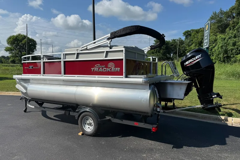 Slide: The Image of 2026 Sun Tracker Bass Buggy 16 XL Select pontoon boat with Mercury outboard motor. - 2