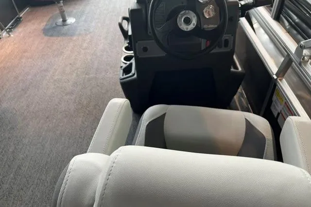 Slide: The Image of Interior view of 2026 Sun Tracker Bass Buggy 18 DLX pontoon boat cockpit. - 7