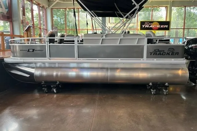 The Image of 2026 Sun Tracker Bass Buggy 18 DLX pontoon boat displayed indoors. - 0