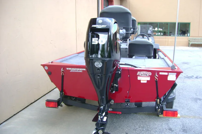 Slide: The Image of 2026 Tracker Bass Tracker Classic XL boat with Mercury 50 engine, red exterior. - 4