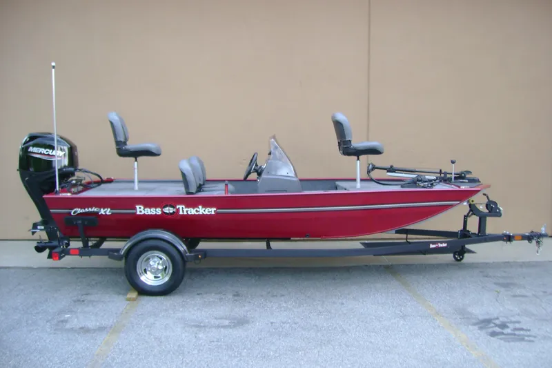 The Image of 2026 Tracker Bass Tracker Classic XL boat on trailer, side view. - 0