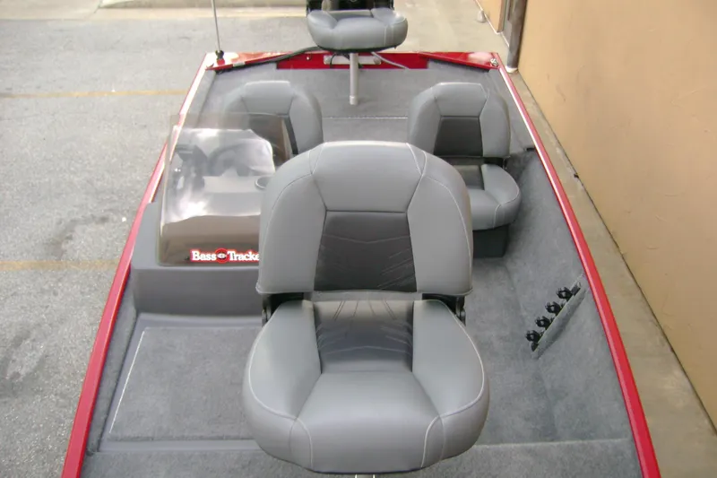Slide: The Image of 2026 Tracker Bass Tracker Classic XL boat interior with gray seating and red accents. - 5