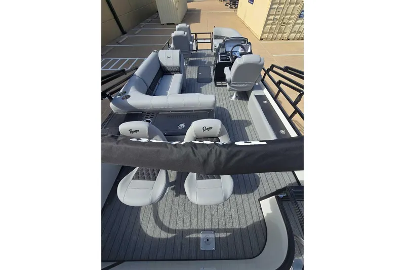 Slide: The Image of 2026 Ranger 223FC boat interior with luxurious tan seating and modern design. - 10