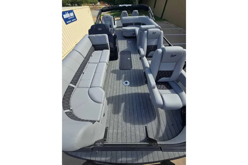 Slide: The Image of Luxurious tan and black leather seating in 2026 Ranger 223FC with diamond stitching. - 9