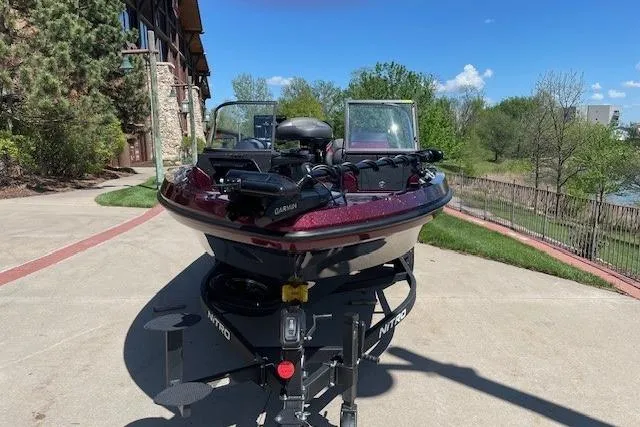 Slide: The Image of 2026 Nitro ZV20 Pro boat on trailer, parked outdoors on a sunny day. - 2